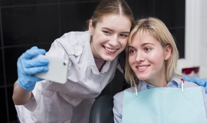 happy-dentist-taking-selfie-with-patient